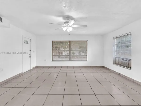a view of an empty room with a window