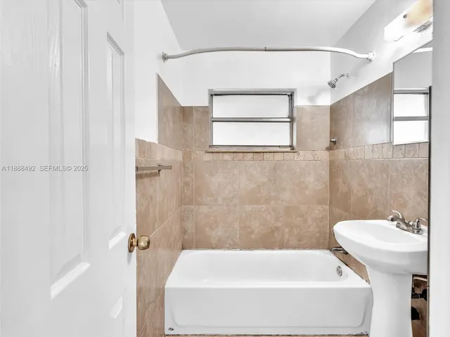 a bathroom with a sink and toilet