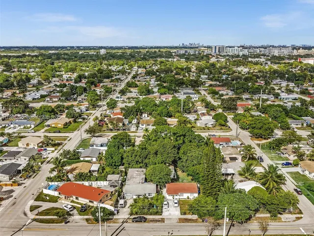 an aerial view of residential building and lake