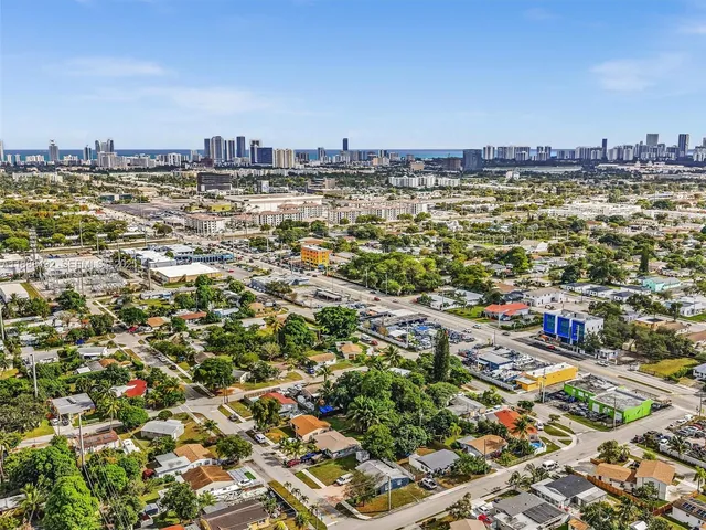 an aerial view of residential building and ocean