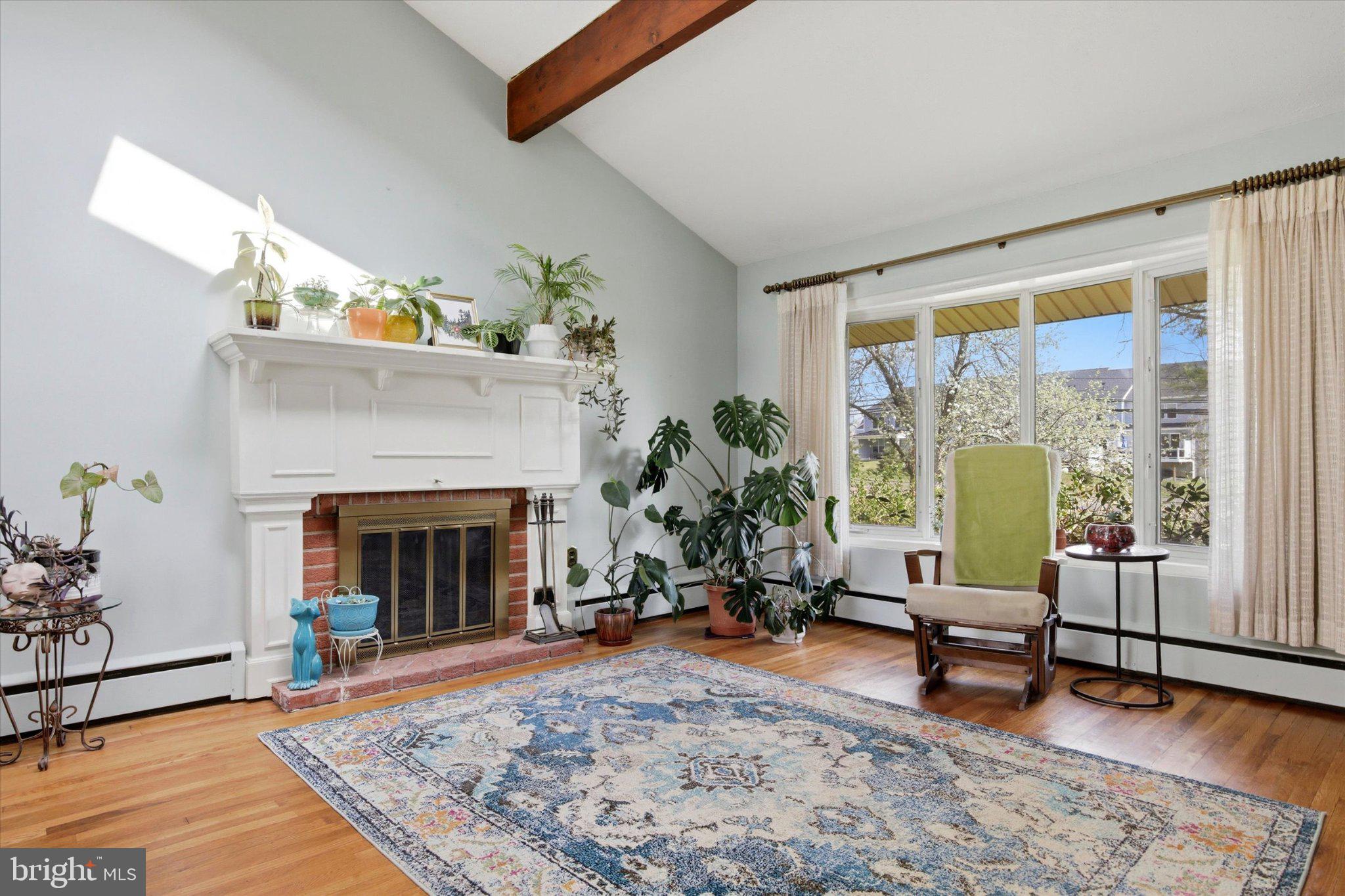 3386 Bristol Road Chalfont, PA 18914 - Photo 4 of 35 Sunlit living space with lush greenery.