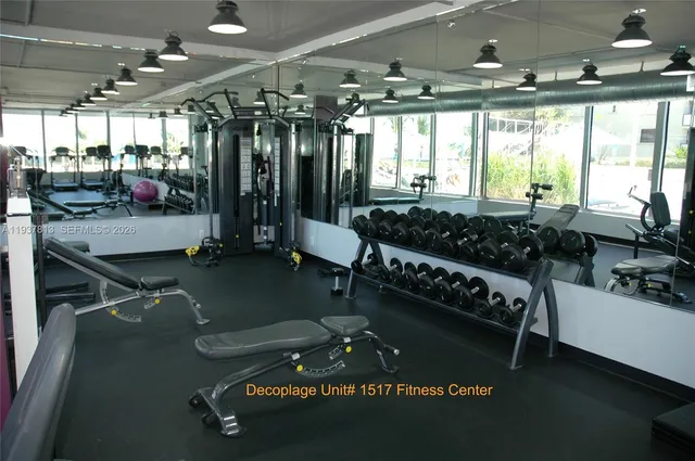 a room with gym equipment and a large window