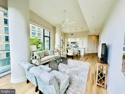 a kitchen with sink refrigerator and large window