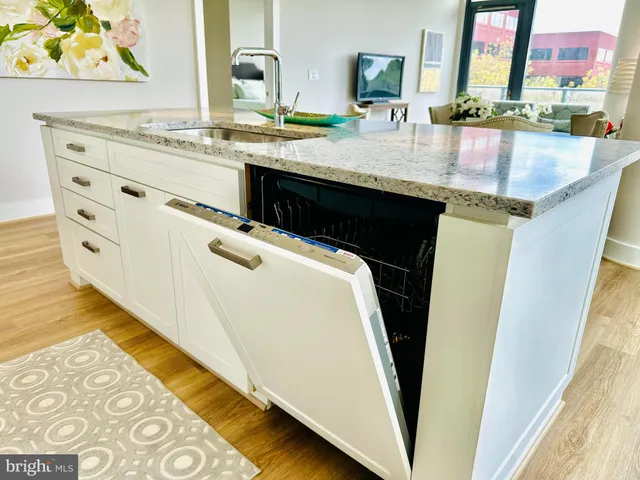 a living room with furniture and a rug