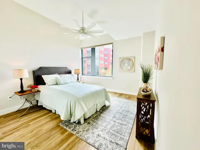 a view of a room with racks on the wall and a window