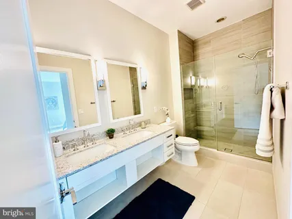 a large white kitchen with a large window