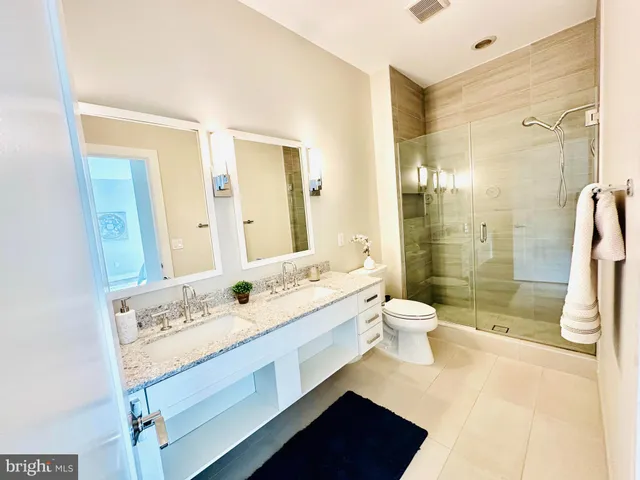 a large white kitchen with a large window