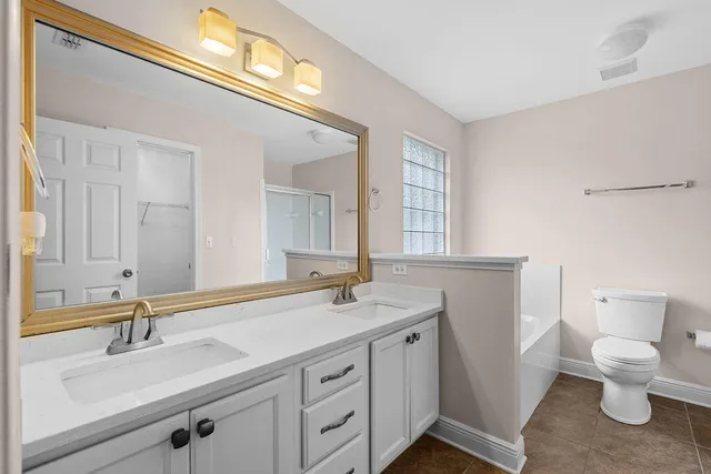 a white bath tub sitting next to a window