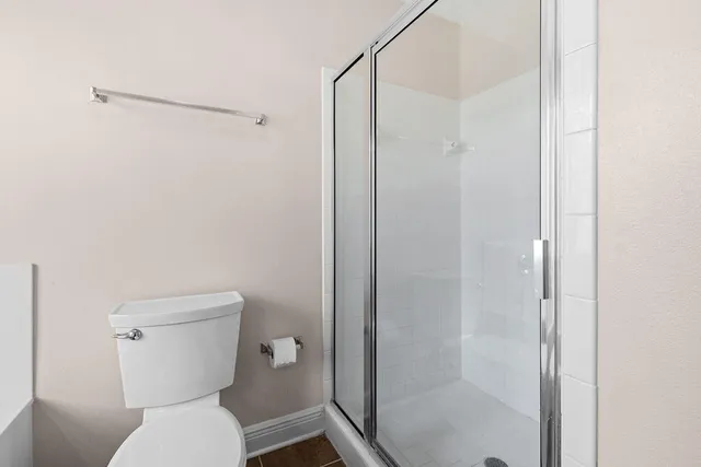 a living room with furniture a rug and a large window