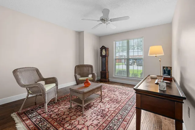 a view of a chairs and table in the balcony