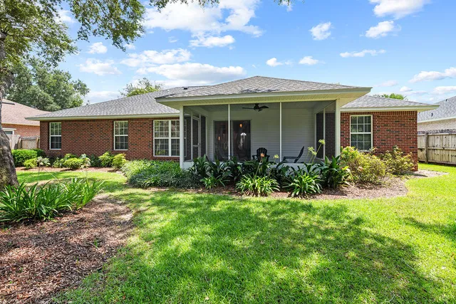 a view of a house with garden and yard