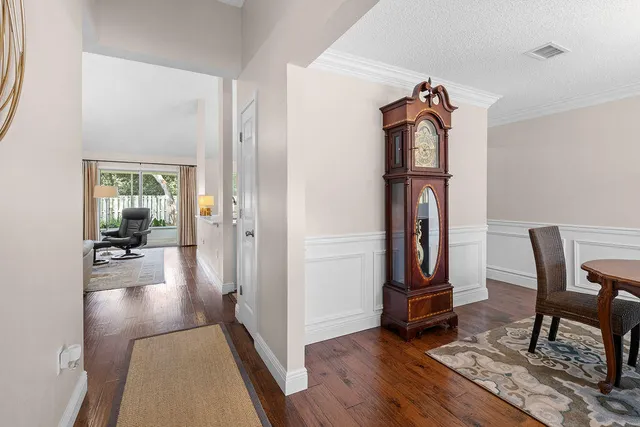 wooden floor in a hall with a glass door