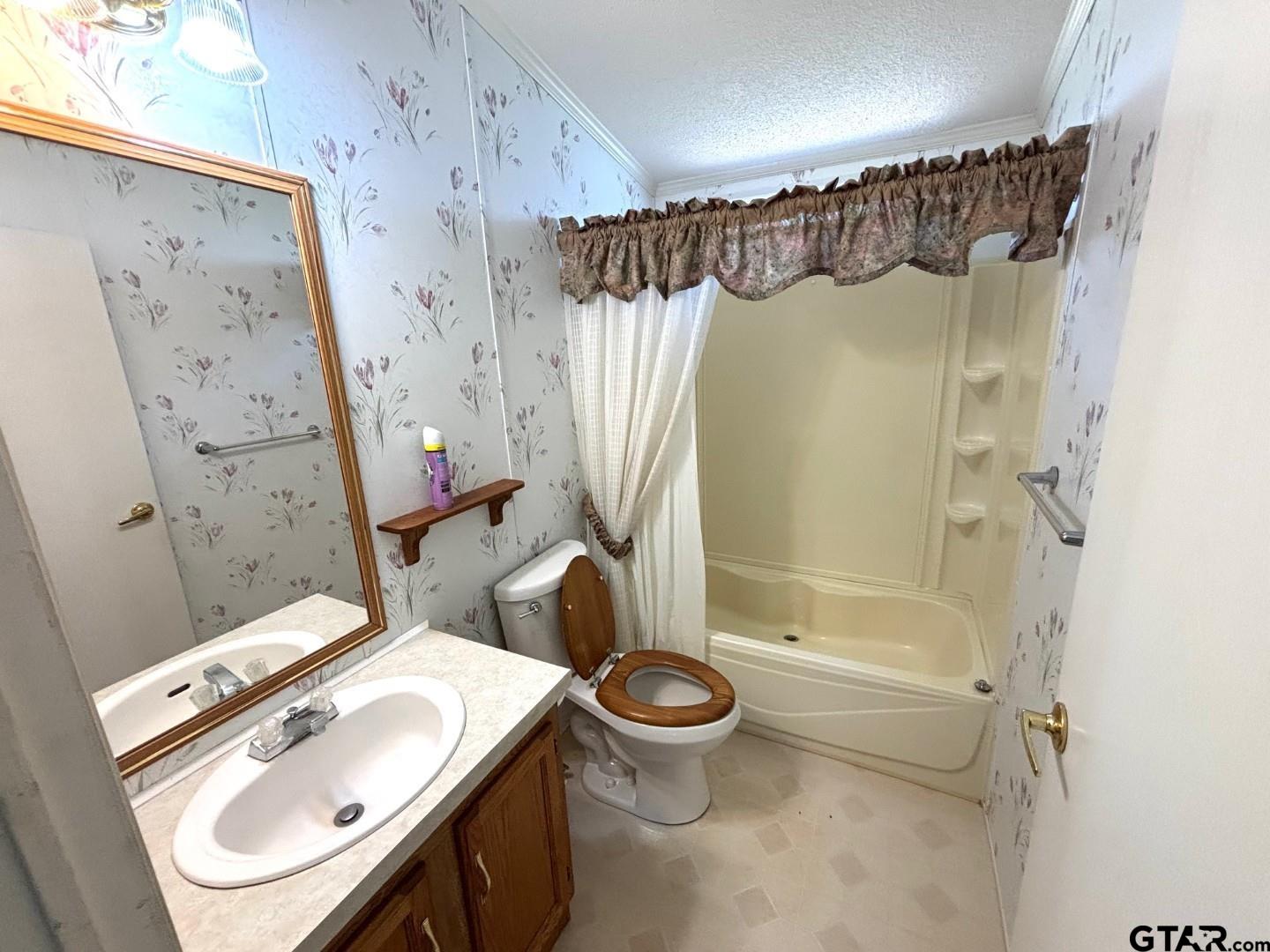21893 Boles Road Frankston, TX 75763 - Photo 19 of 33 a bathroom with a sink toilet and shower