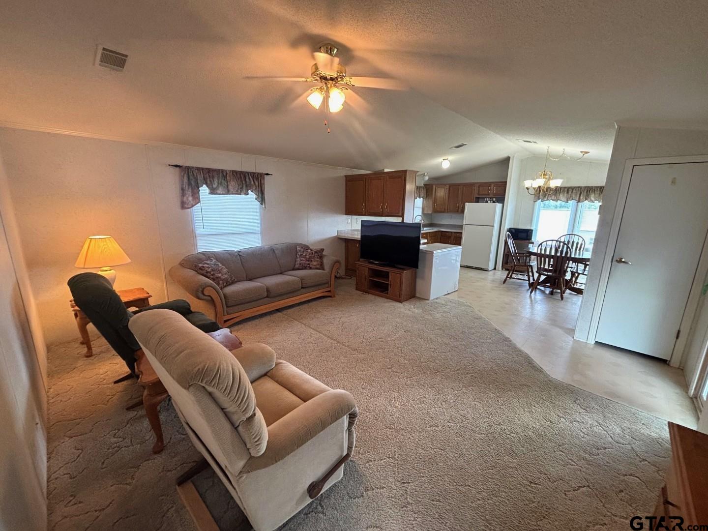 21893 Boles Road Frankston, TX 75763 - Photo 10 of 33 a living room with furniture a couch and a chandelier