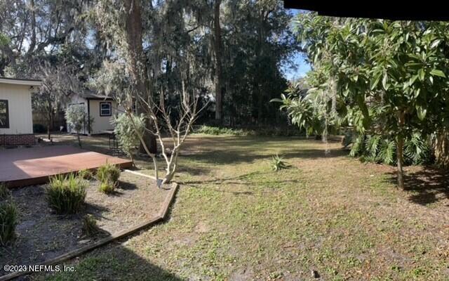 4642 Morris Road Jacksonville, FL 32225 - Photo 16 of 18 a view of a yard with trees