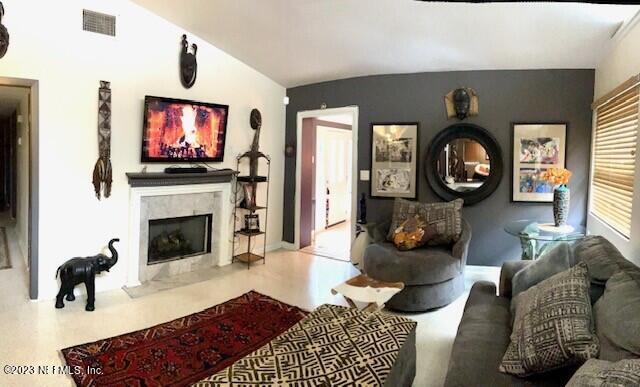4642 Morris Road Jacksonville, FL 32225 - Photo 3 of 18 a living room with furniture a flat screen tv and a fireplace
