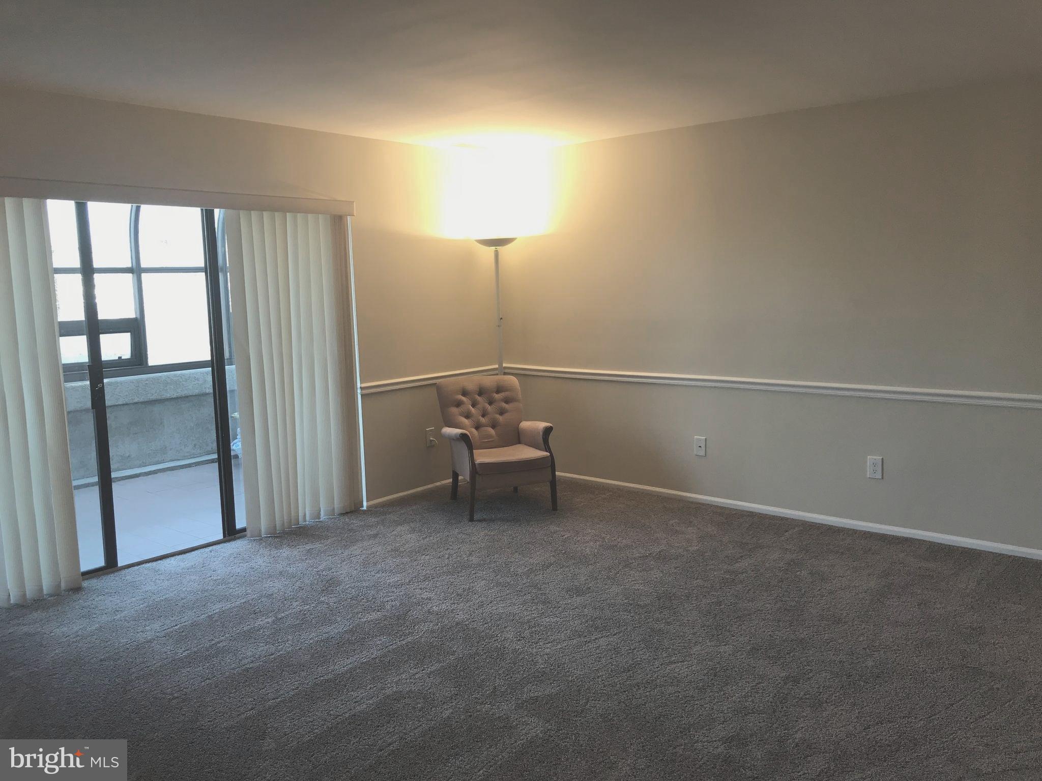 2901 Fallstaff Road, Unit 505 Baltimore, MD 21209 - Photo 8 of 15 a view of empty room with windows