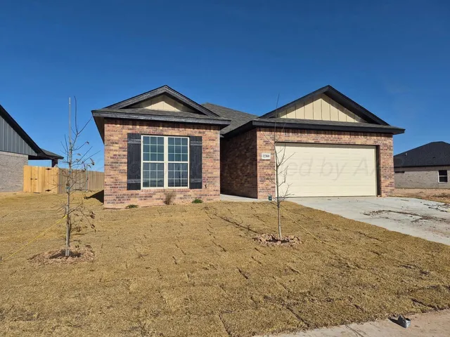 a front view of a house with yard
