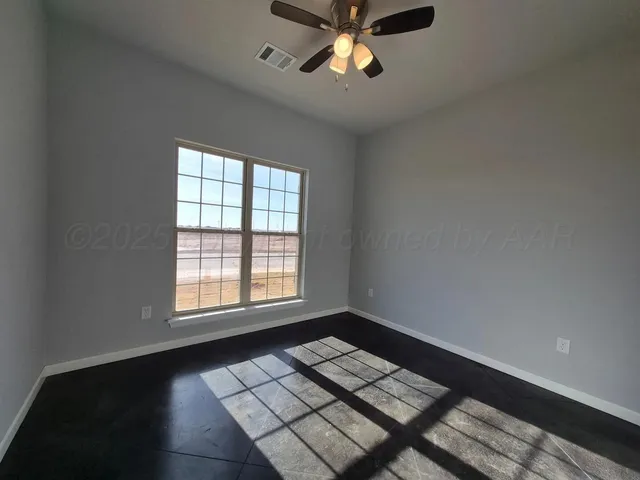 a view of workspace with wooden floor and window