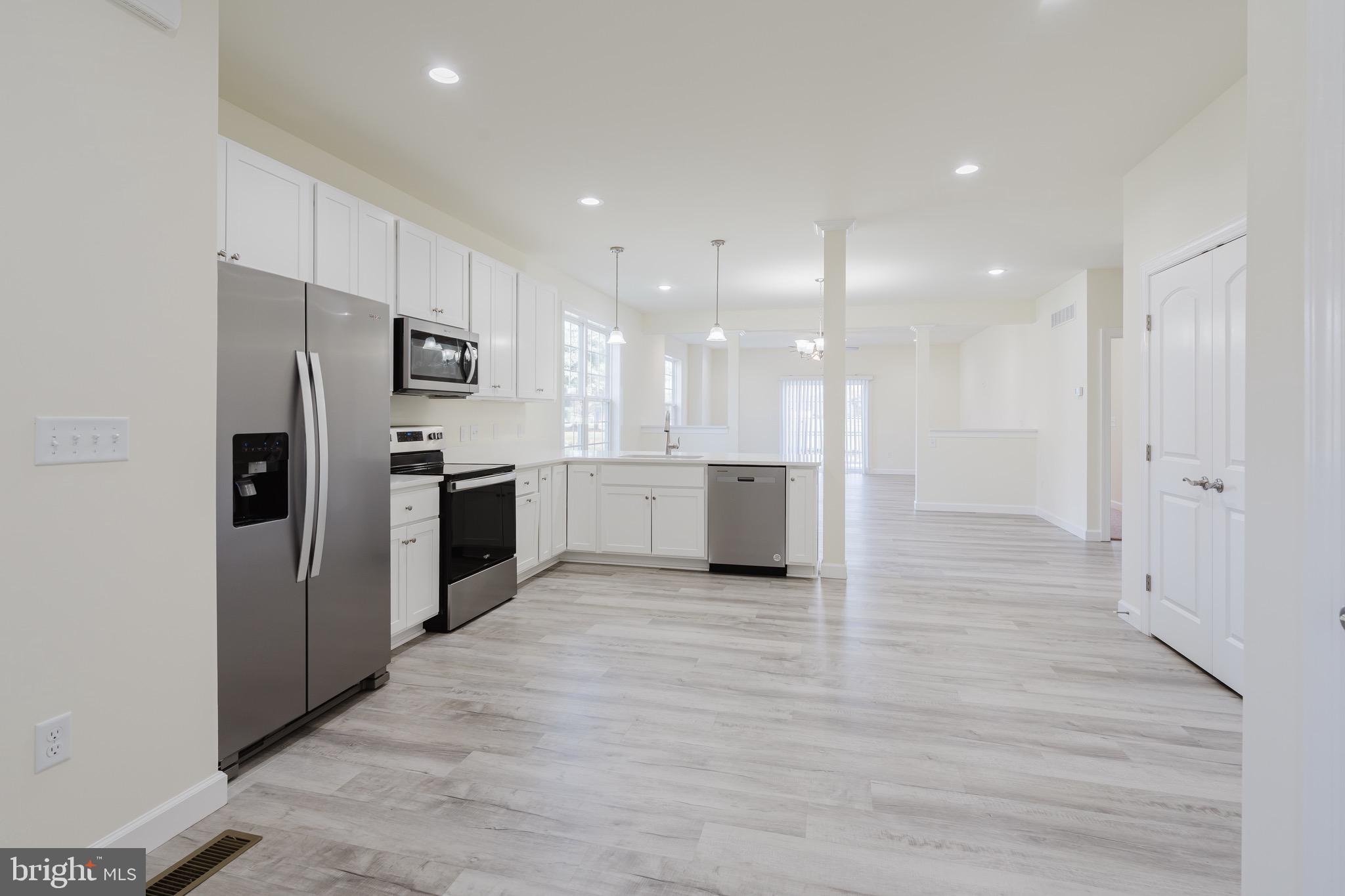 51 Mapledale Road Dover, DE 19904 - Photo 16 of 53 a view of a kitchen with a refrigerator and a sink