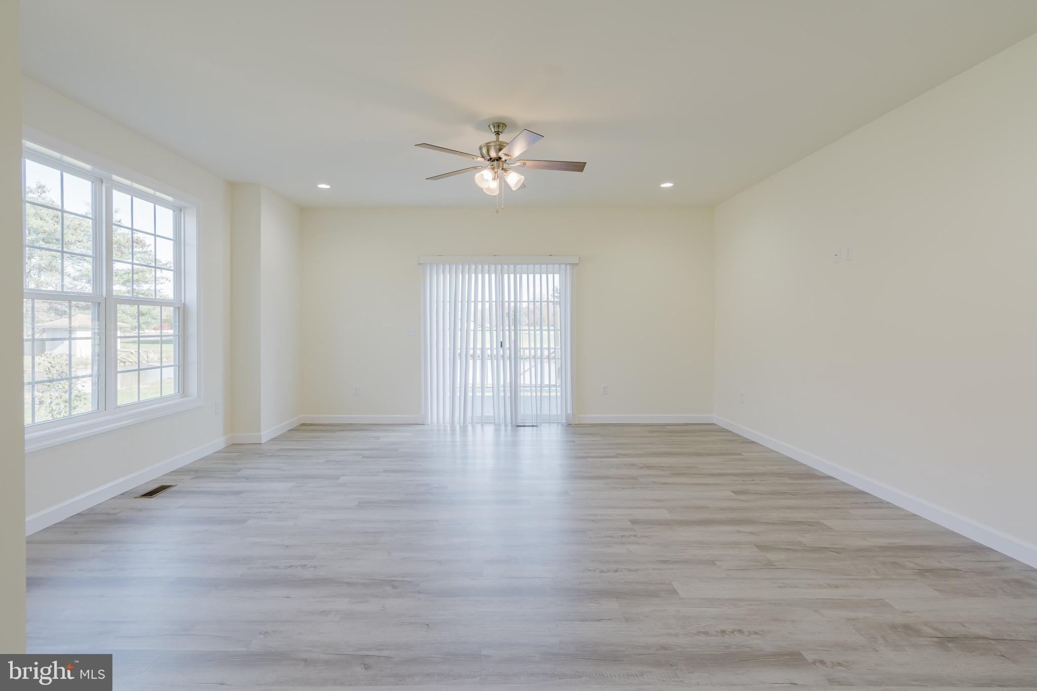 51 Mapledale Road Dover, DE 19904 - Photo 21 of 53 wooden floor in an empty room with a window