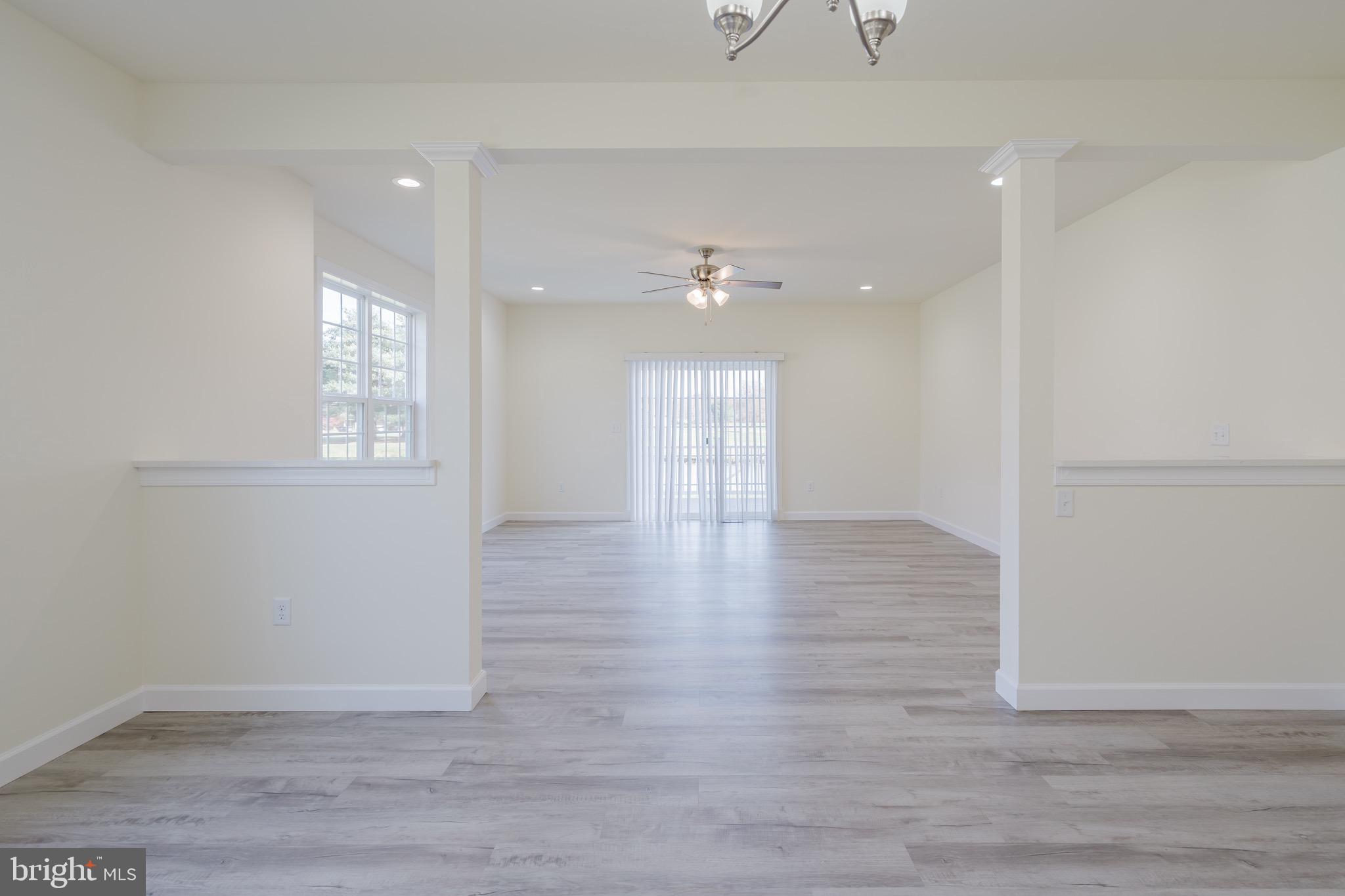 51 Mapledale Road Dover, DE 19904 - Photo 22 of 53 a view of an empty room with wooden floor and a window