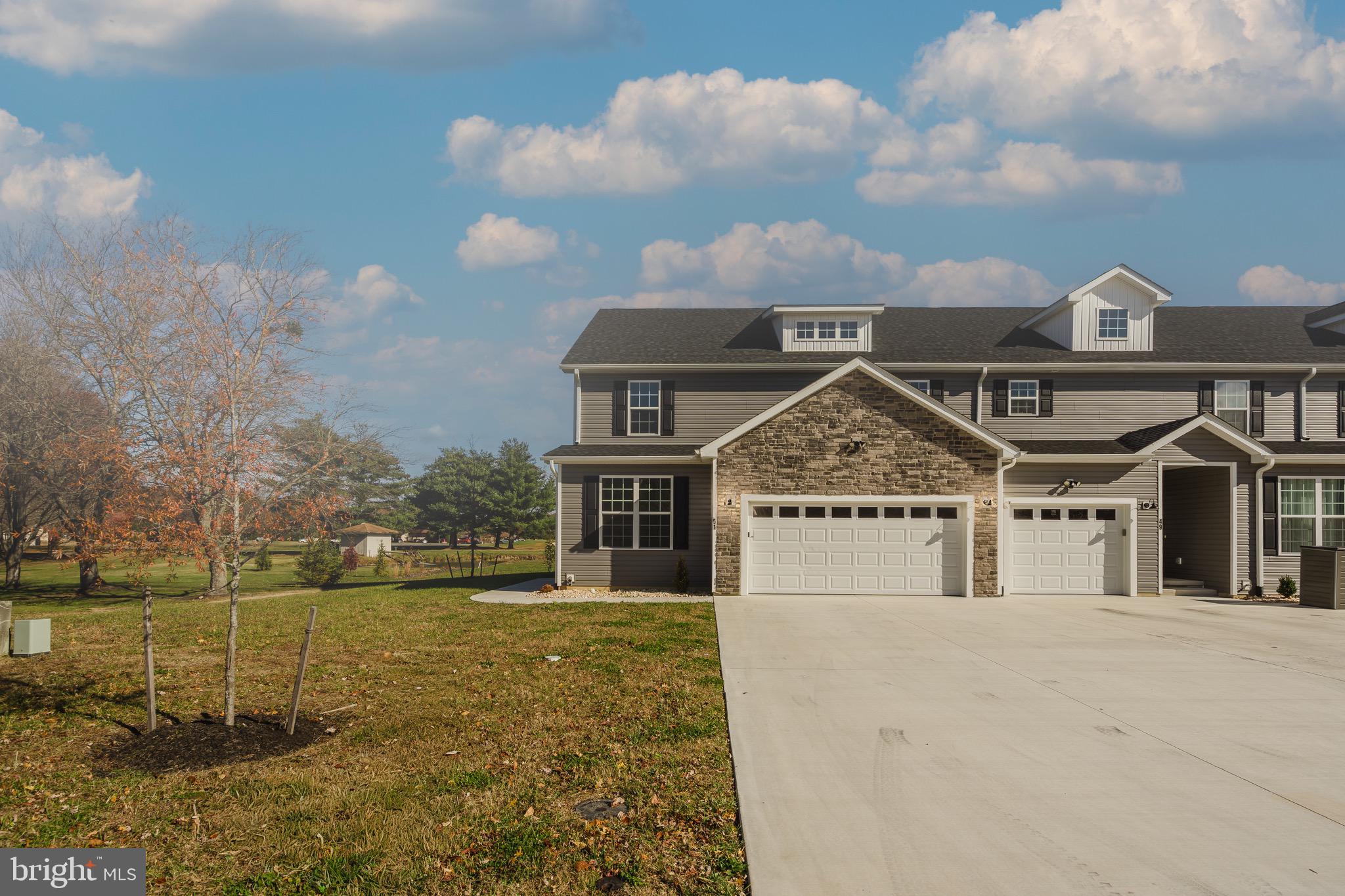51 Mapledale Road Dover, DE 19904 - Photo 4 of 53 a view of a big house with a big yard and large trees