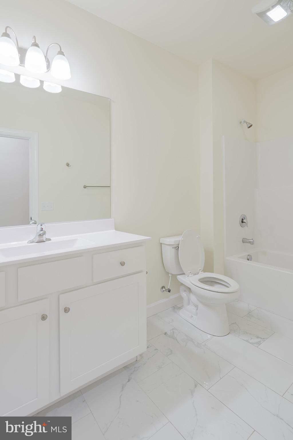 51 Mapledale Road Dover, DE 19904 - Photo 47 of 53 a bathroom with a sink a toilet and a bathtub