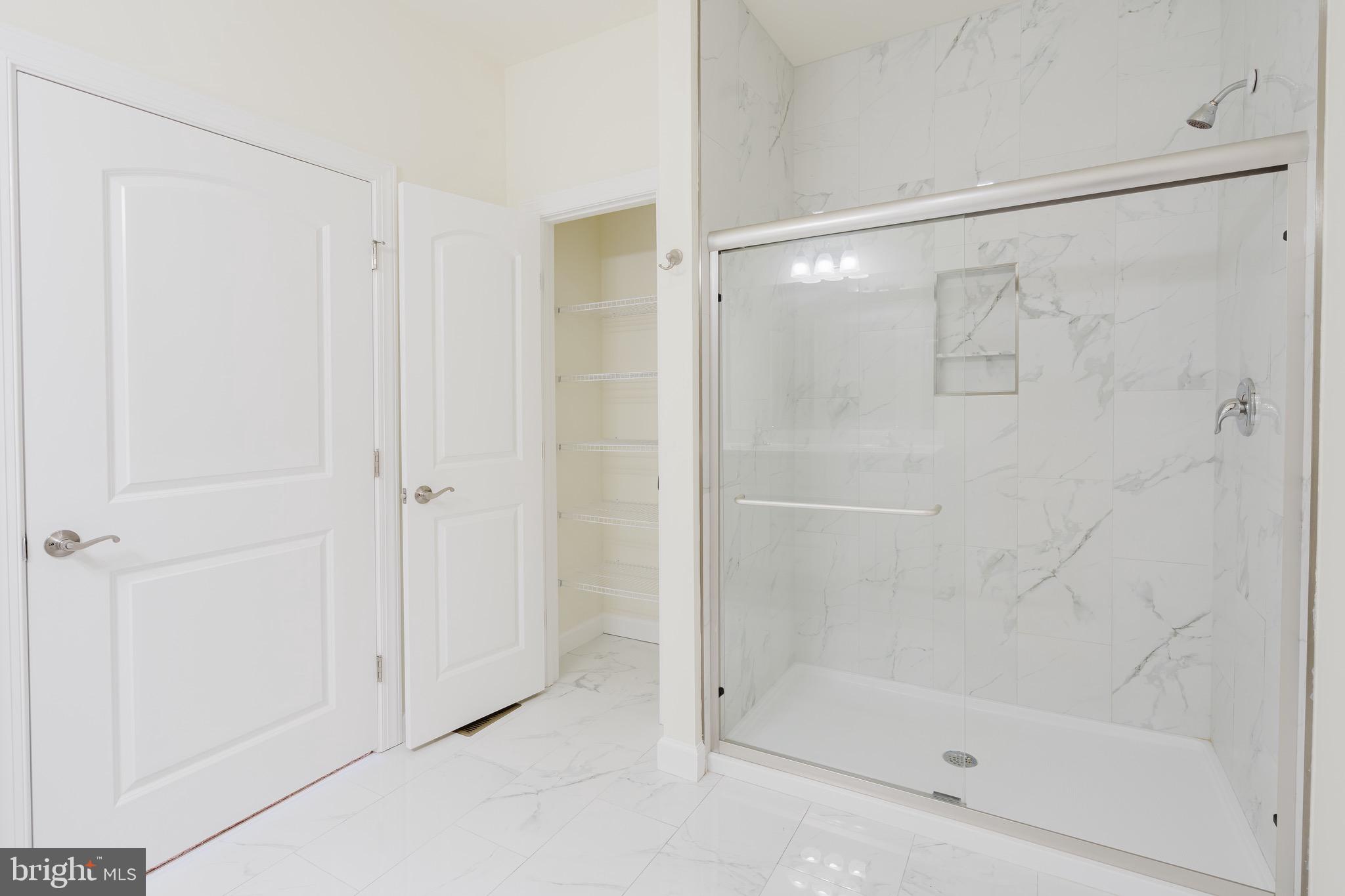 51 Mapledale Road Dover, DE 19904 - Photo 48 of 53 a bathroom with a glass shower door