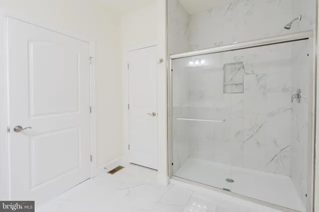 a bathroom with a double vanity sink mirror and toilet