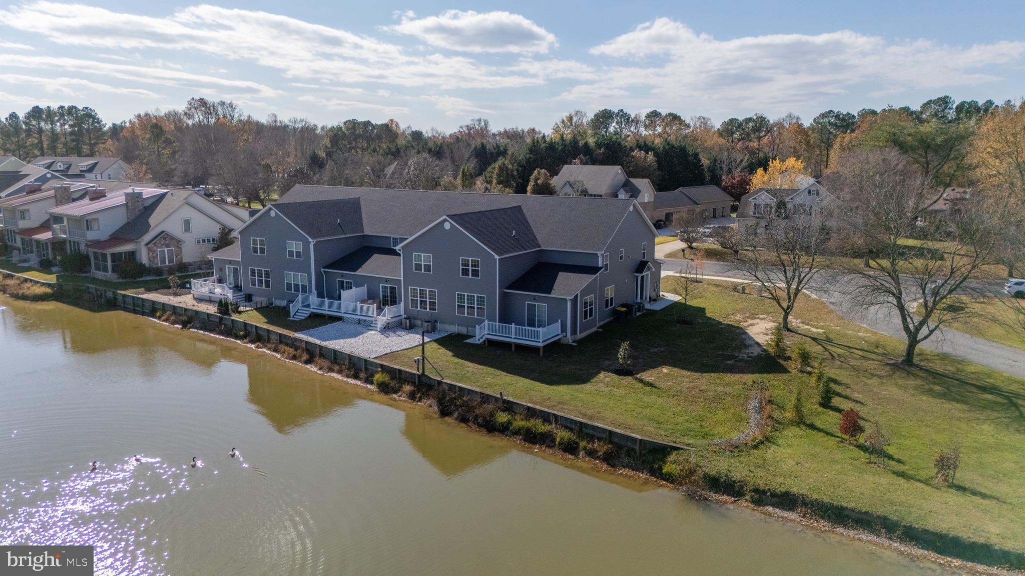 51 Mapledale Road Dover, DE 19904 - Photo 9 of 53 a view of a lake with a house in the background