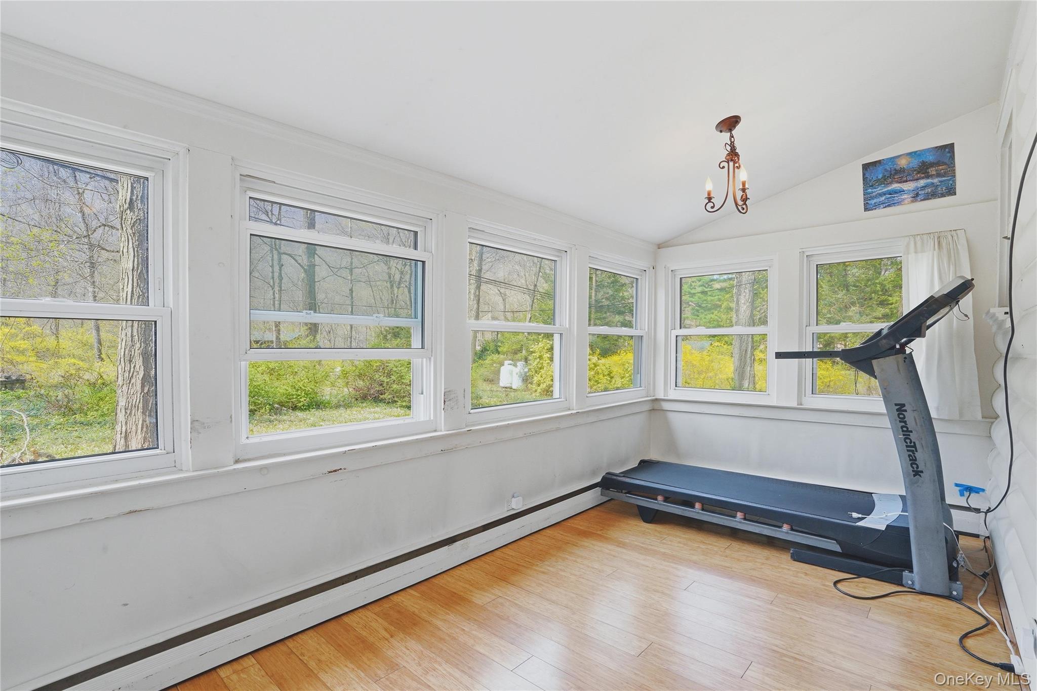 167 Highland Road Cold Spring, NY 10516 - Photo 19 of 22 This room features numerous windows, providing ample natural light and views of the surrounding trees