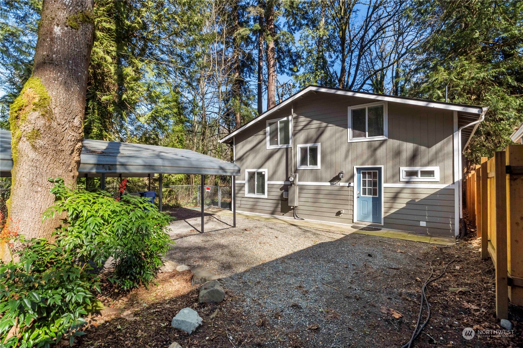 26404 Lake Fenwick Road South Kent, WA 98032 - Photo 37 of 38 a front view of a house with a yard and garage