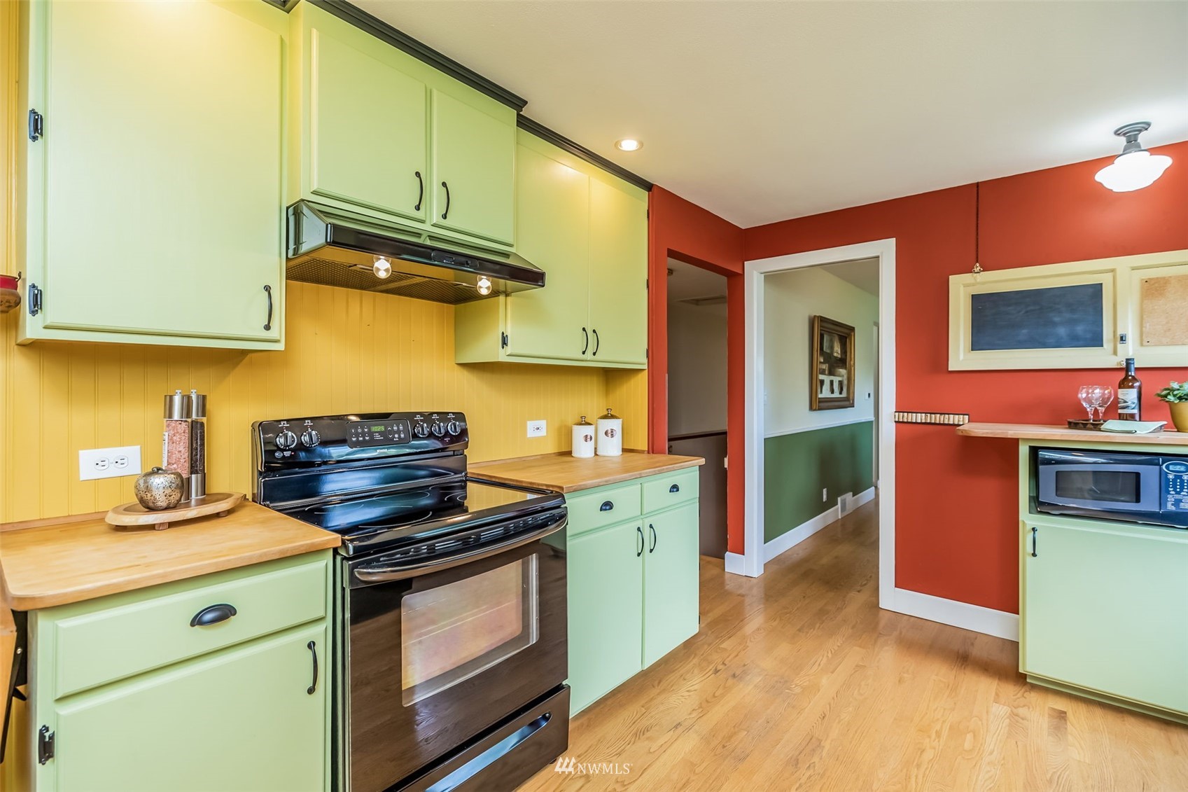 8402 13th Avenue Southwest Seattle, WA 98106 - Photo 11 of 40 a kitchen with stainless steel appliances granite countertop a stove and a sink