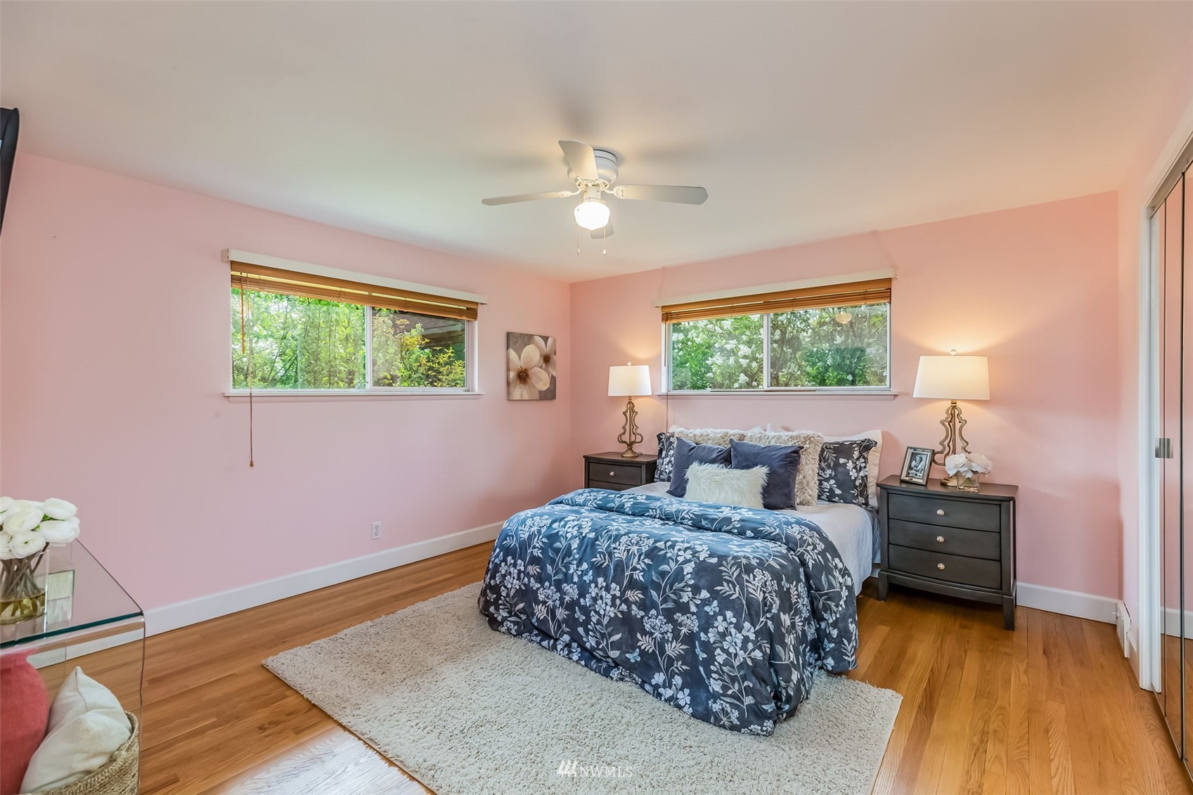 8402 13th Avenue Southwest Seattle, WA 98106 - Photo 15 of 40 a bedroom with a bed chandelier and a window