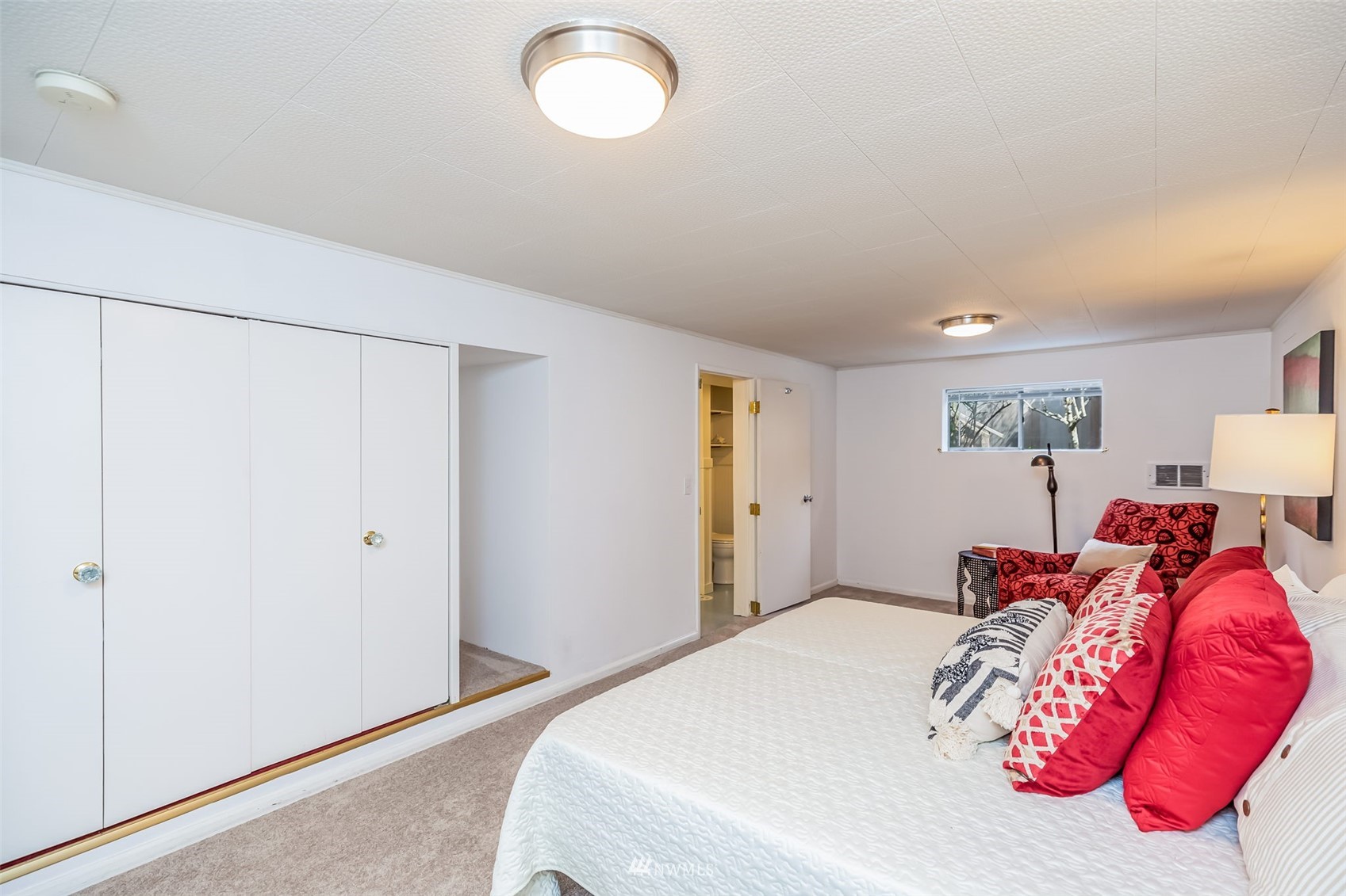 8402 13th Avenue Southwest Seattle, WA 98106 - Photo 25 of 40 a bedroom with a bed and a painting on the wall