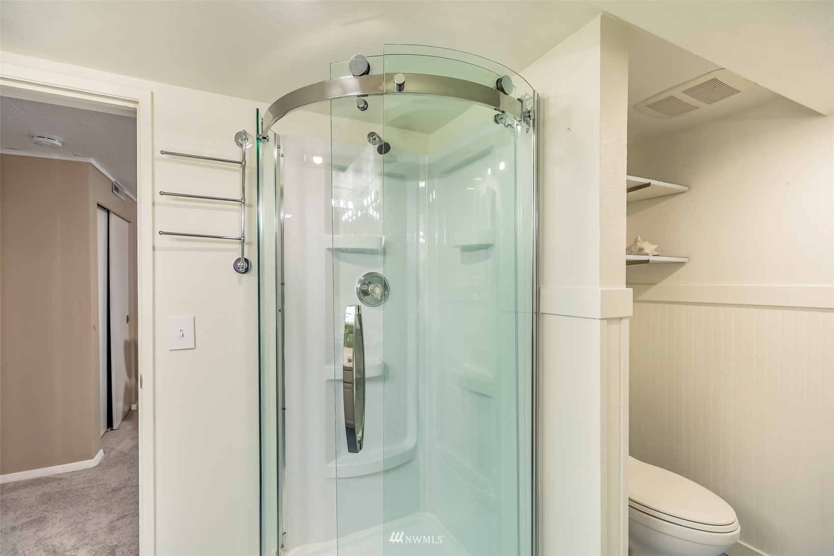 8402 13th Avenue Southwest Seattle, WA 98106 - Photo 26 of 40 a bathroom with a glass shower door