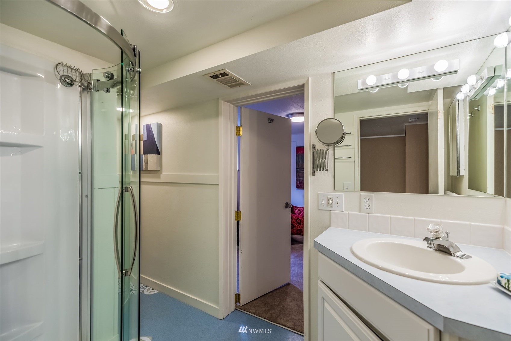 8402 13th Avenue Southwest Seattle, WA 98106 - Photo 27 of 40 a bathroom with a sink and a mirror