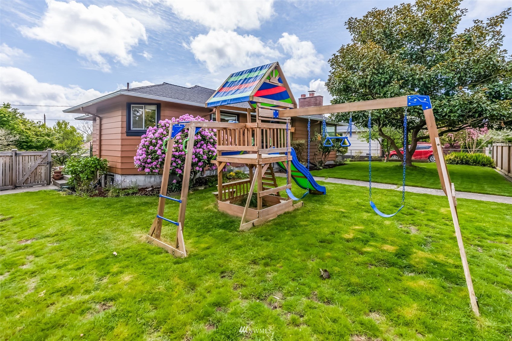 8402 13th Avenue Southwest Seattle, WA 98106 - Photo 30 of 40 a view of an house with backyard and a slide