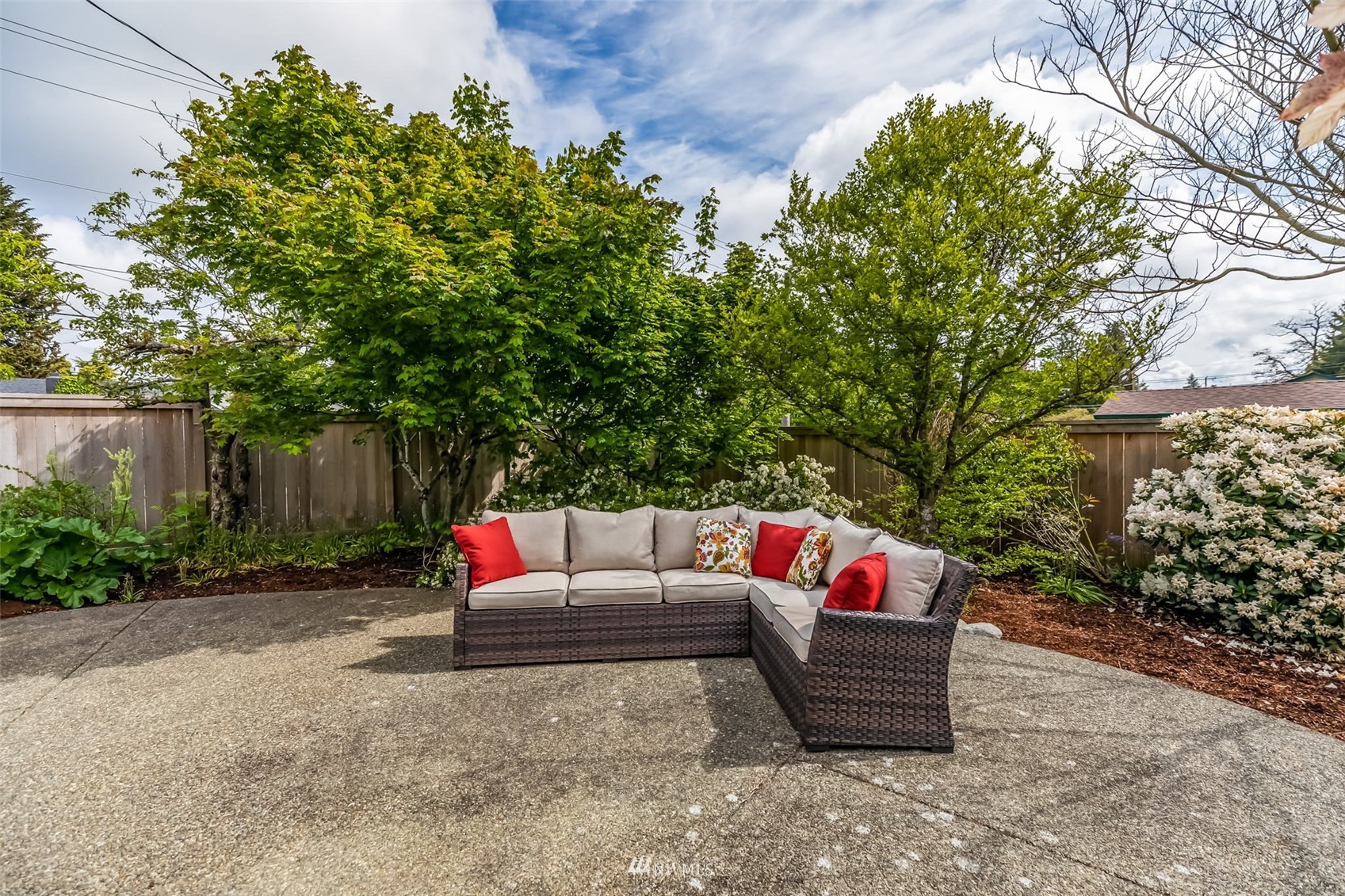 8402 13th Avenue Southwest Seattle, WA 98106 - Photo 32 of 40 a view of outdoor sitting area with furniture and wooden fence