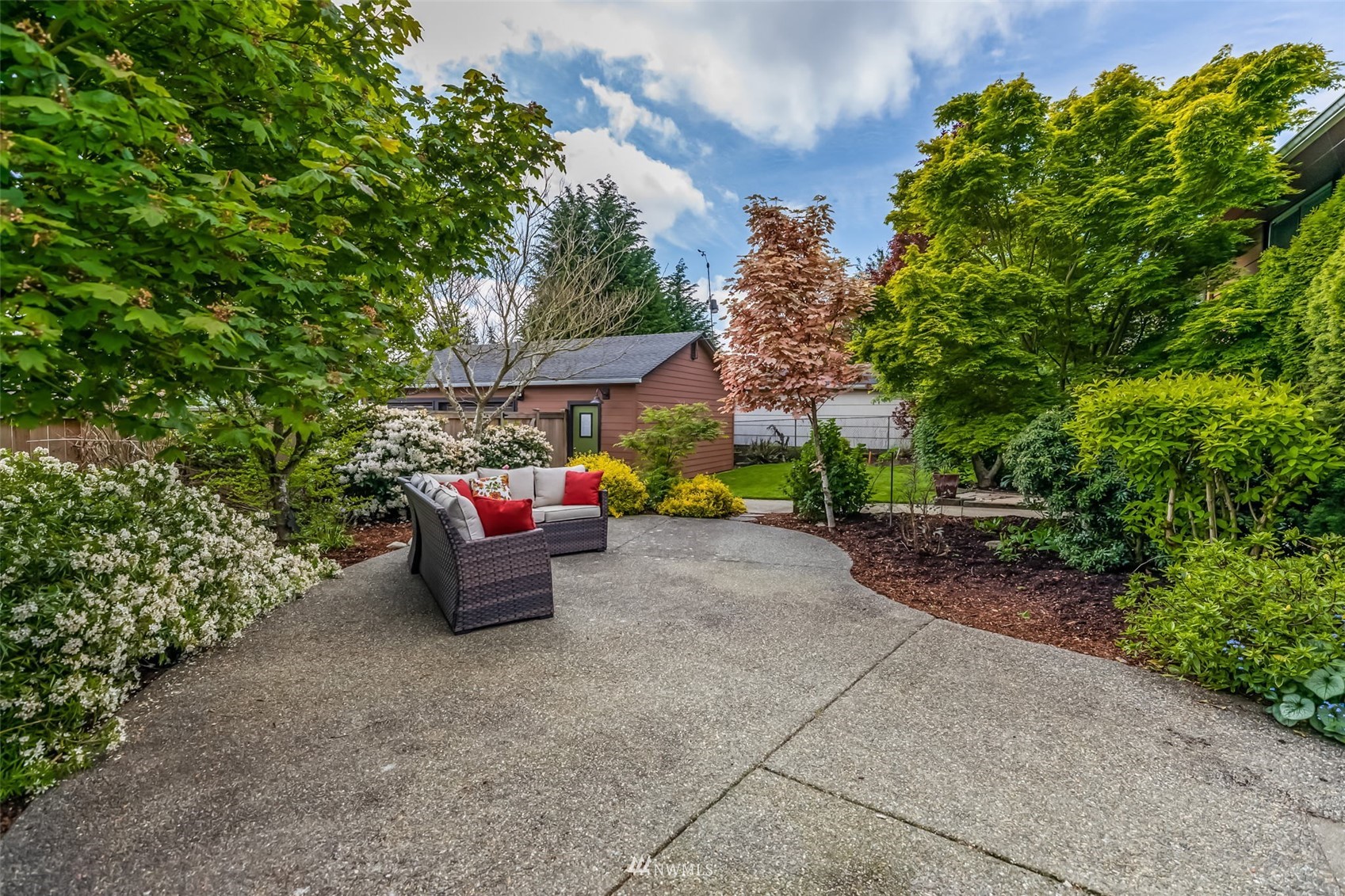 8402 13th Avenue Southwest Seattle, WA 98106 - Photo 33 of 40 a backyard of a house with outdoor seating