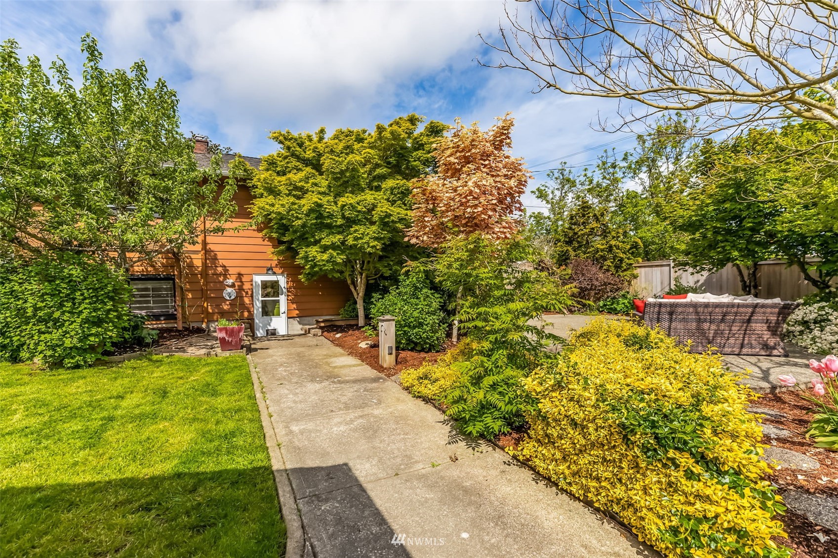 8402 13th Avenue Southwest Seattle, WA 98106 - Photo 36 of 40 a view of a yard with plants and large trees