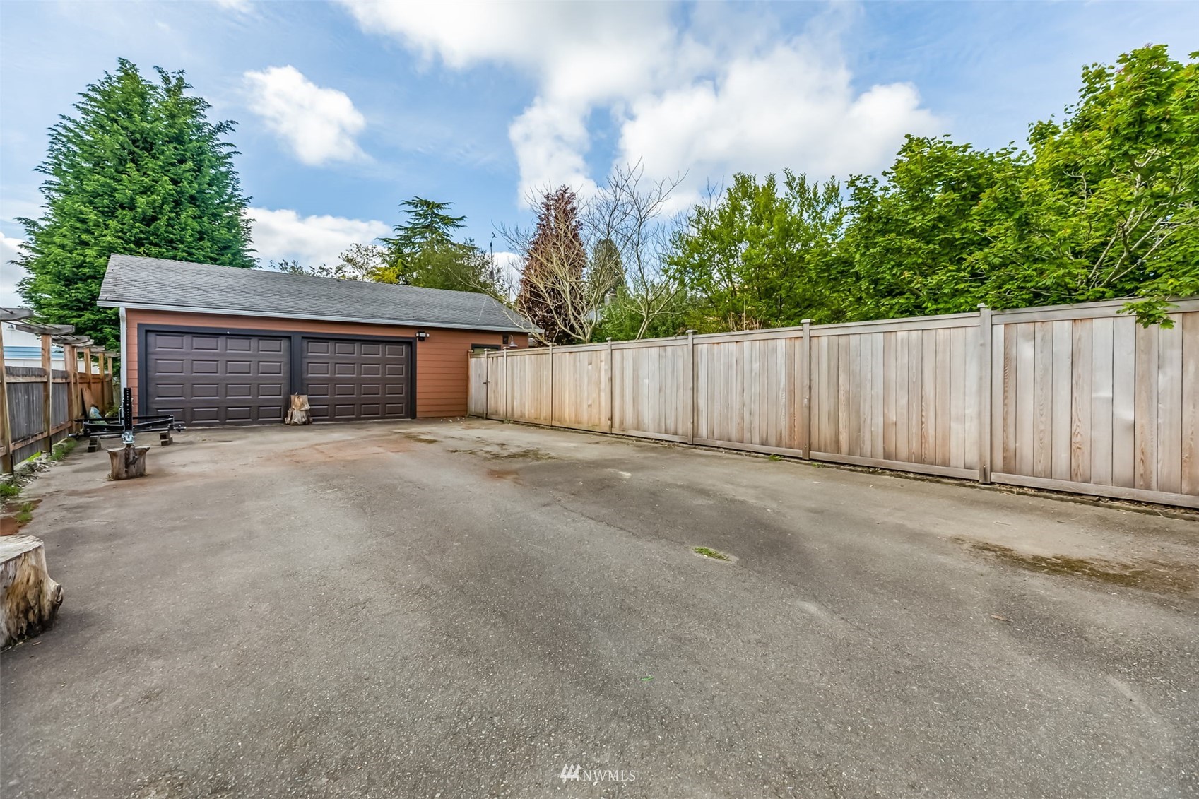 8402 13th Avenue Southwest Seattle, WA 98106 - Photo 38 of 40 a view of a house with wooden fence