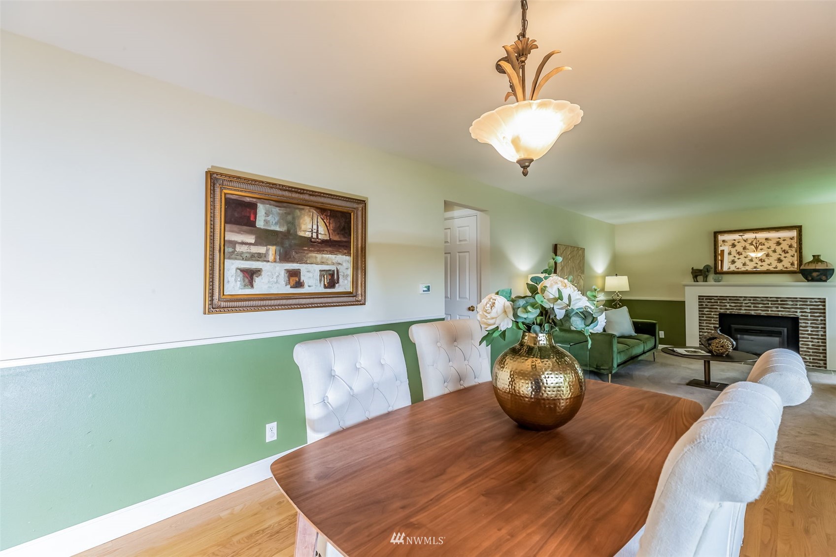 8402 13th Avenue Southwest Seattle, WA 98106 - Photo 7 of 40 a view of a dining room with furniture a potted plant and wooden floor
