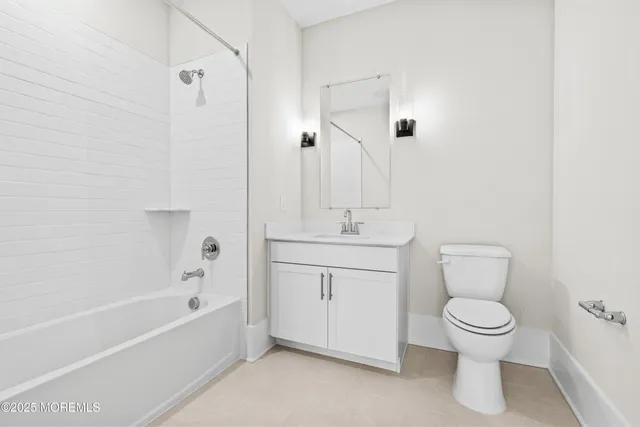 a bathroom with a toilet sink and bathtub