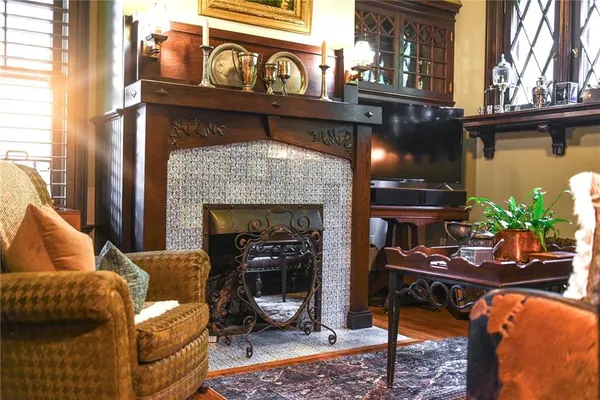a living room with furniture and a fireplace