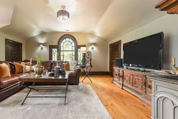a living room with furniture and a flat screen tv