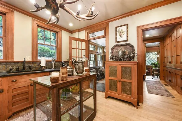 a kitchen with stainless steel appliances granite countertop sink stove and wooden cabinets