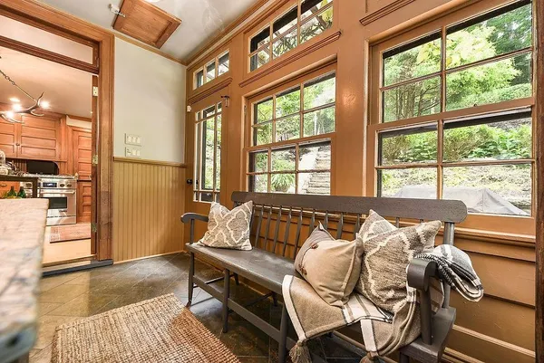 a bed sitting in a bedroom next to a window