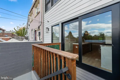 a view of a balcony with a potted plant